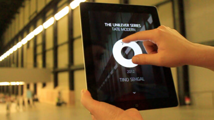 Photograph of the app being used in the Turbine Hall at Tate Modern.